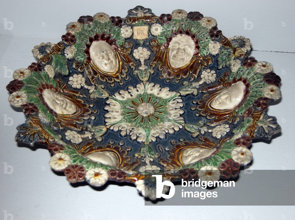 Dish with grotesque faces (faience)