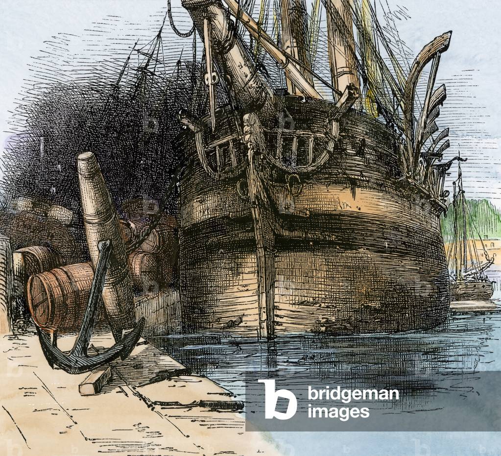 A former whaler moored on the wharf at New Bedford, Massachusetts, circa 1800. 19th century lithography.
