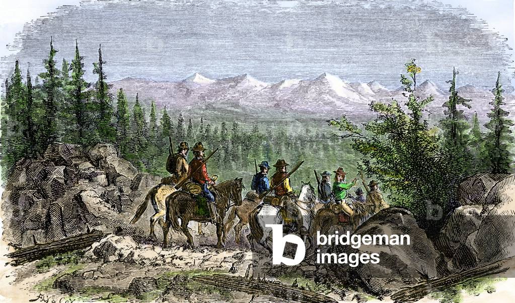 Group of pioneers on horseback seeing for the first time the Sierra Nevada chain, 19th century. Colouring engraving of the 19th century.