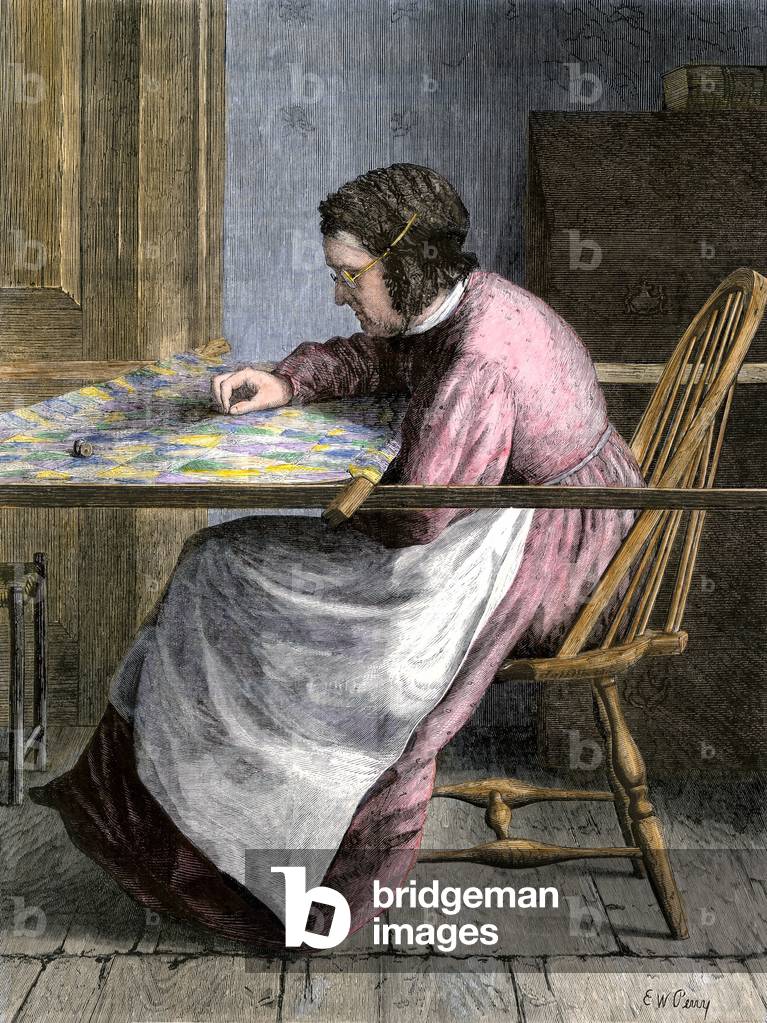 Woman embroidering a bedspread, 19th century.