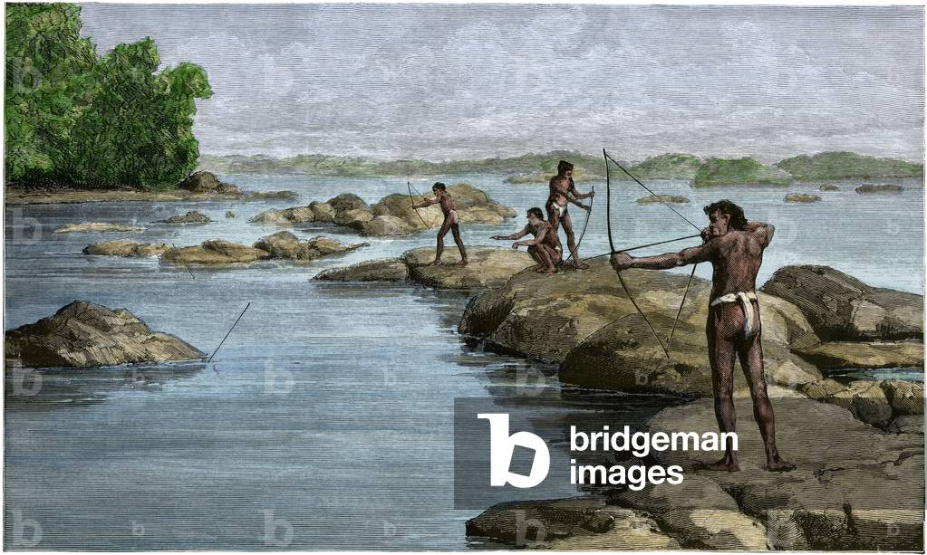 The natives of British Guiana (present-day Guyana) hunt a bow on the Berbice River, circa 1880 - Colorisee engraving, 19th century - British Guiana natives shooting sting-rays on the Berbice River, 1880s - Hand-colored woodcut of a 19th-century illustration
