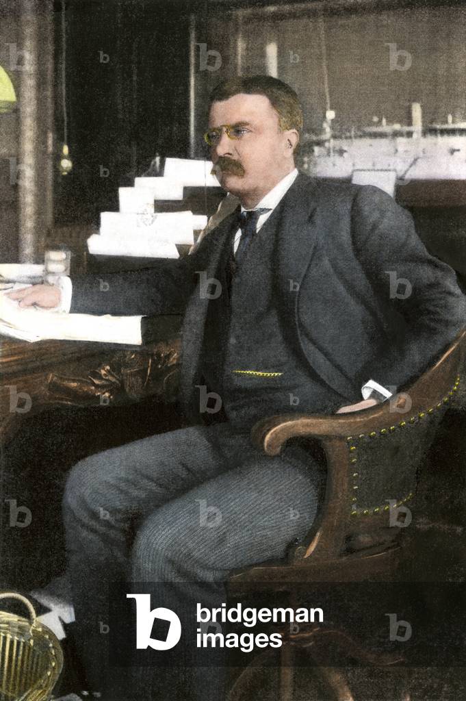 Portrait of Theodore Roosevelt (1858-1919), assistant secretary to the American Navy, in his office in Washington (USA), 1898 - Colorisation d'apres une photographie 19th century - Assistant Secretary of the Navy Theodore Roosevelt in his Washington office, 1898 - Hand-colored halftone reproduction of a 19th-century photograph