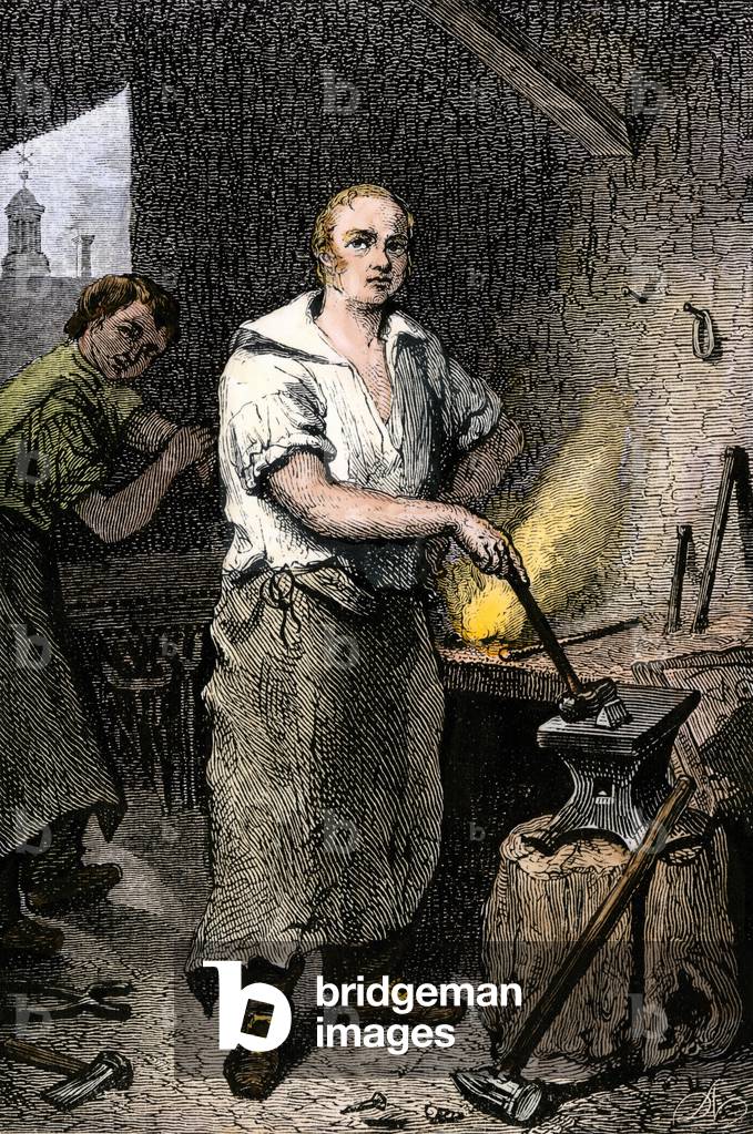 Portrait of Pat Lyon, blacksmith in his forge.
