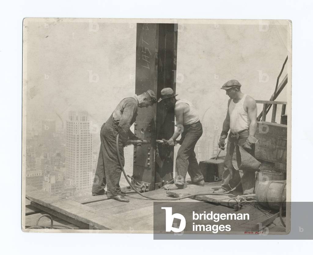 Three workers securing a rivet, Empire State Building, 1931 (gelatin silver print)