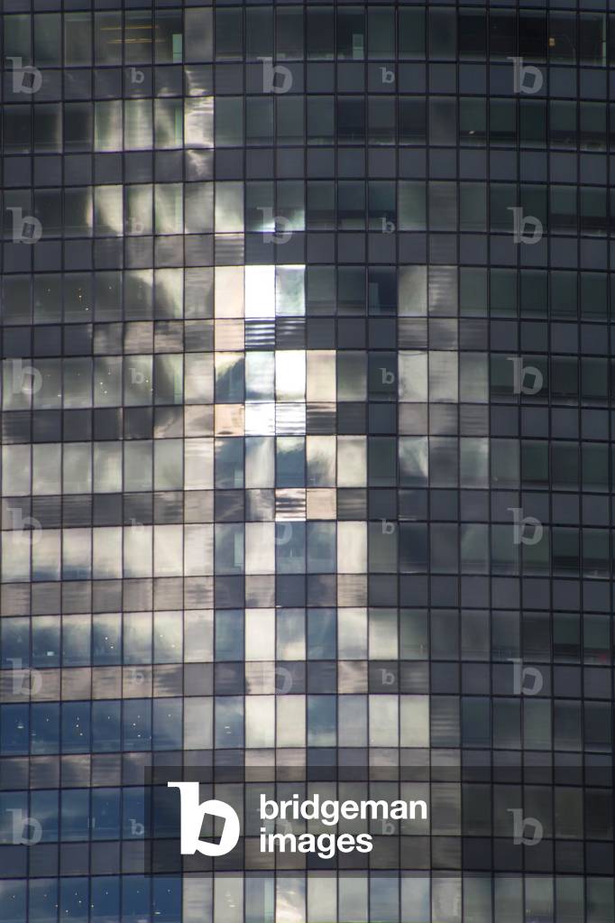 Reflections in windows of contemporary office tower, La Défense, Paris, France (photo).