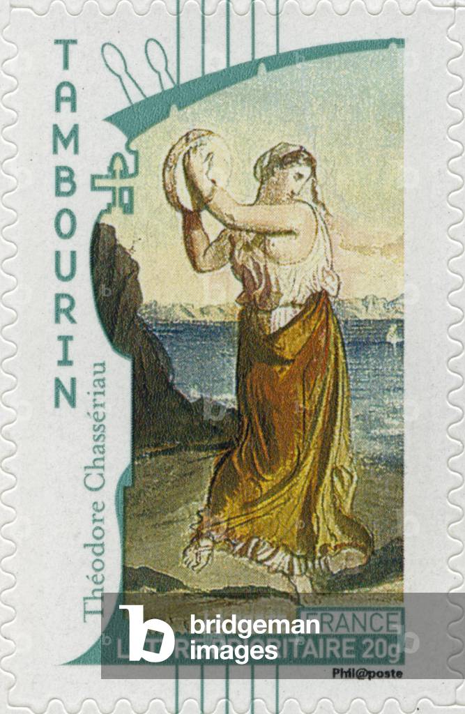 French postage stamp showing a gypsy woman playing the tambourine, from a painting by French artist Théodore Chassériau -