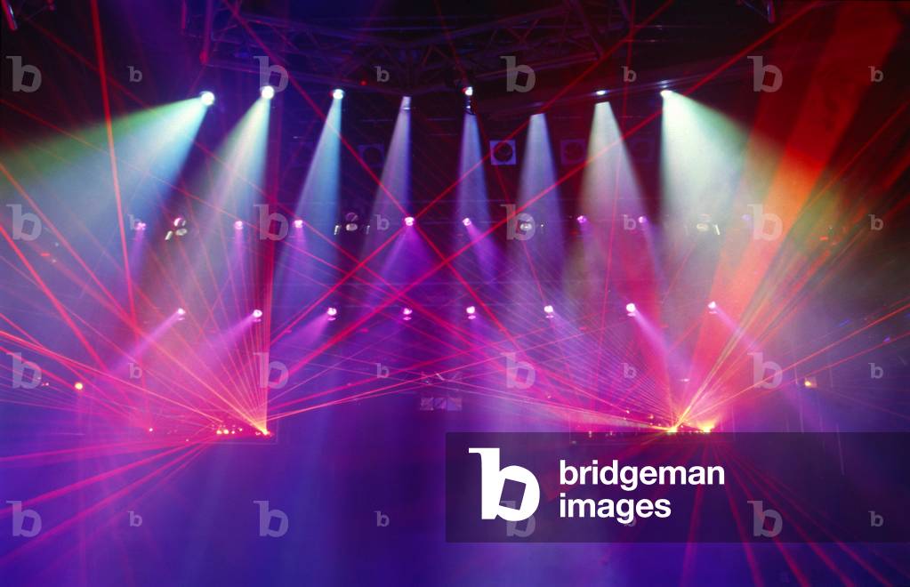 Colourful stage lights with laser beams -