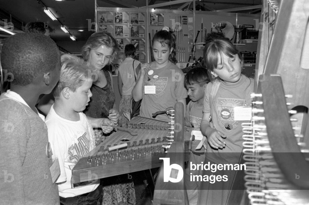 A group of schoolchildren discovering exotic instruments