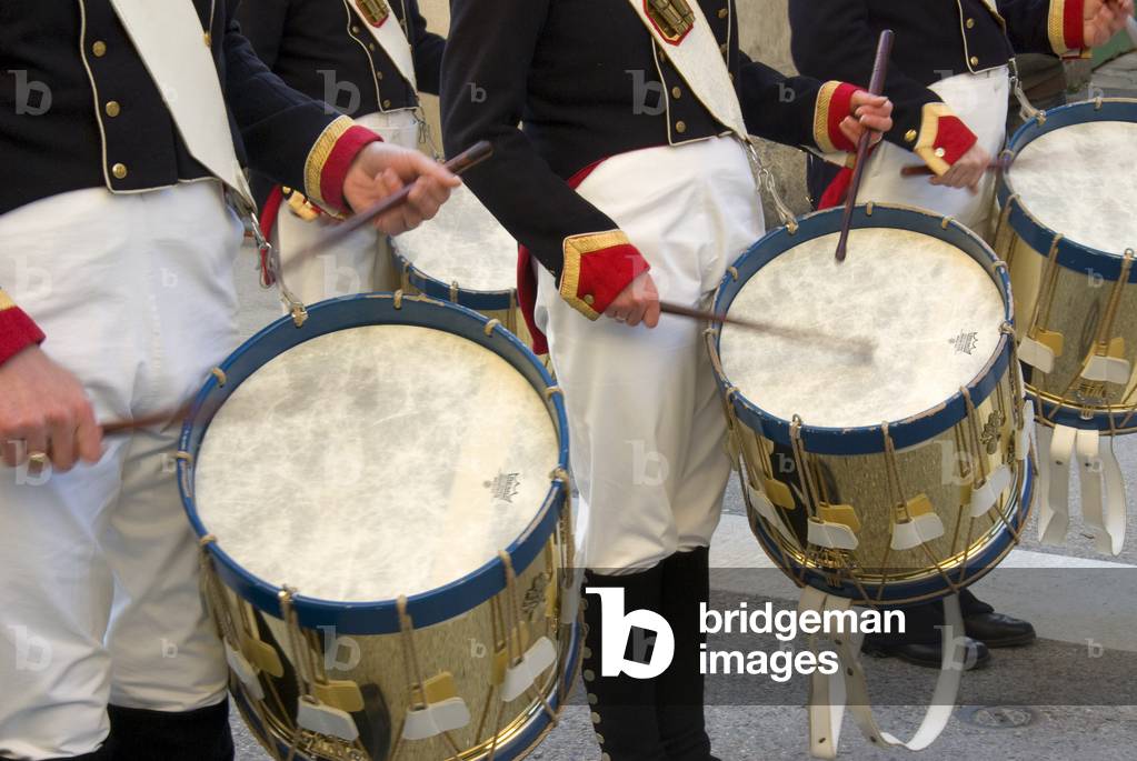 Close-up of two drummers' hands and sticks.