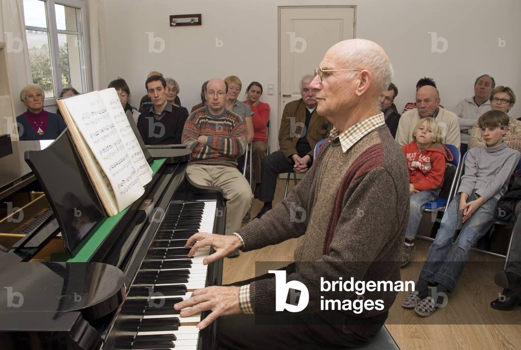 Older man playing the piano