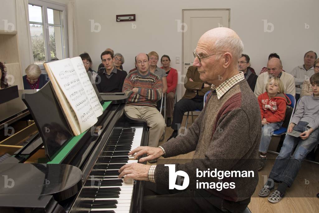Older man playing the piano