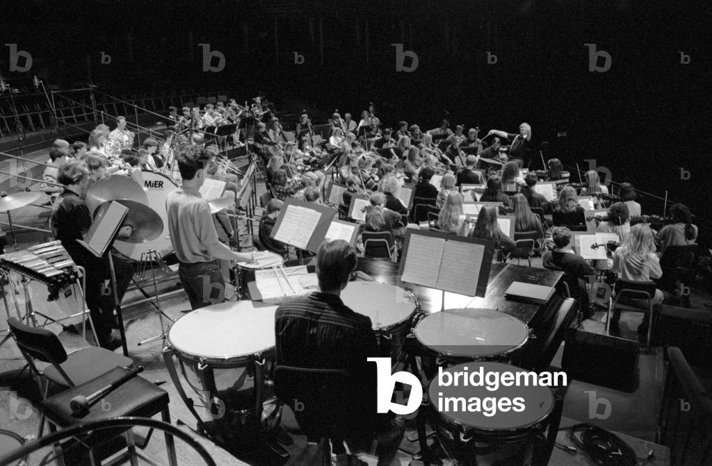 Youth symphony orchestra with percussion section in the foreground