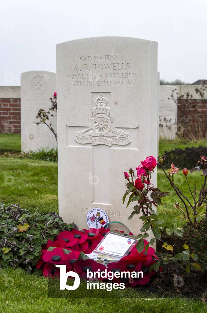 Gravestone and poppies at Hop Store Cemetery, Belgium