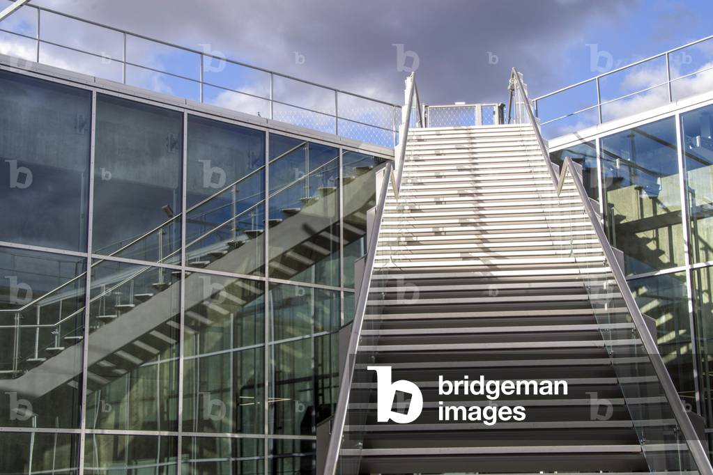 Exterior view of contemporary glass building with staircase, 2018 (photo).