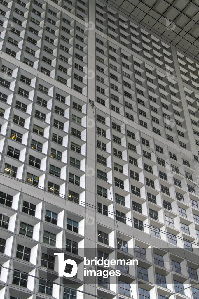 Low-angle view of the multiple windows lining the Grande Arche de La Défense, Paris, France (photo).