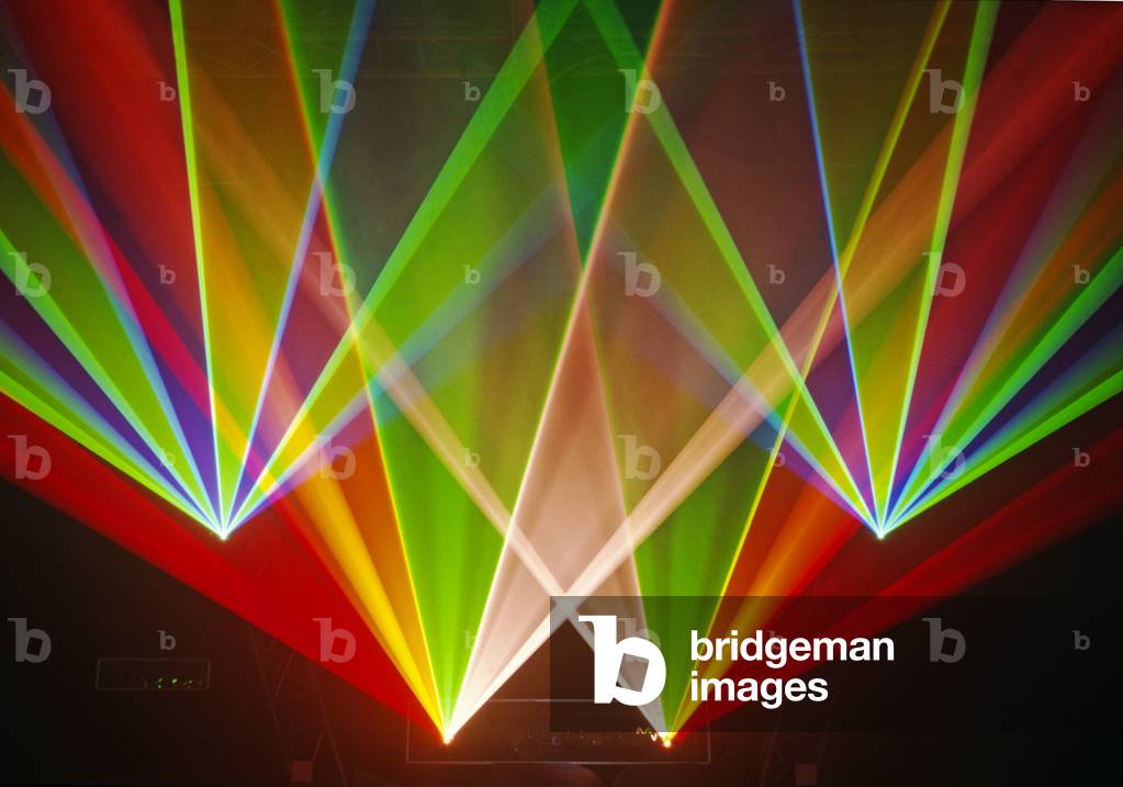Rainbow coloured laser beams forming a fan pattern -