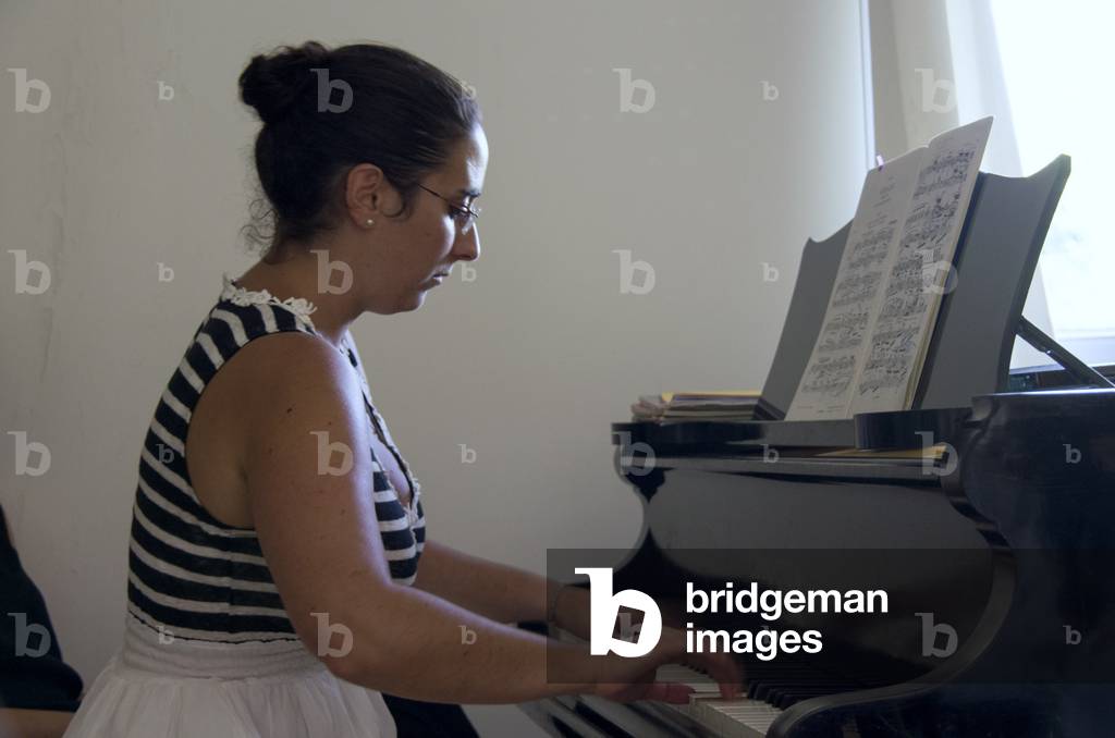 Young woman playing the piano