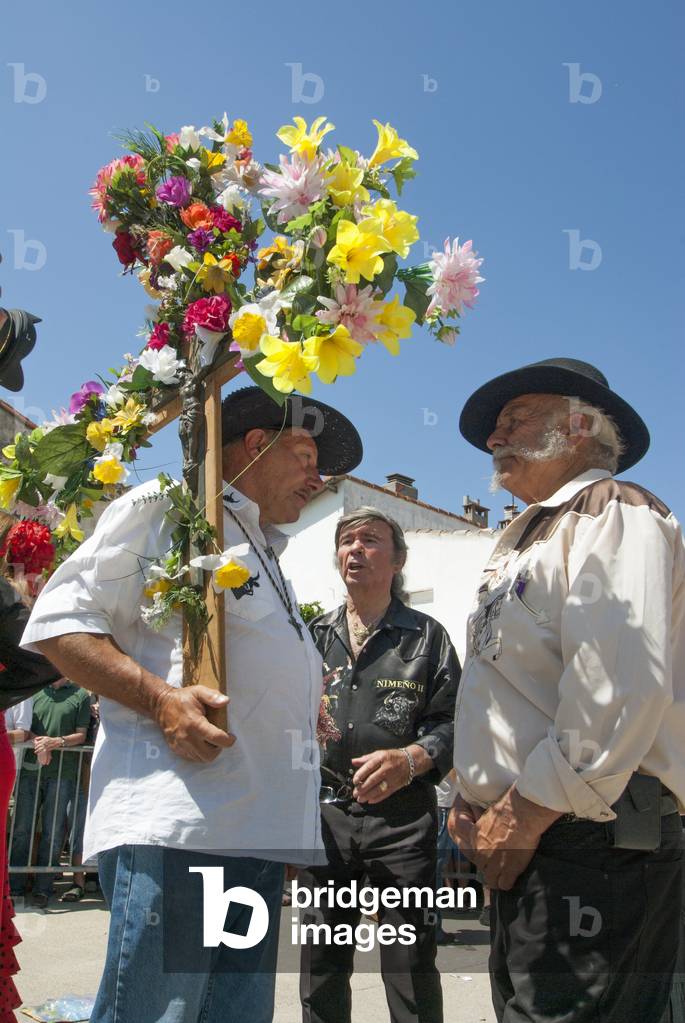 Gypsy men with decorated cross, Saintes-Maries-de-la-Mer pilgrimage, May 2012 (photo)