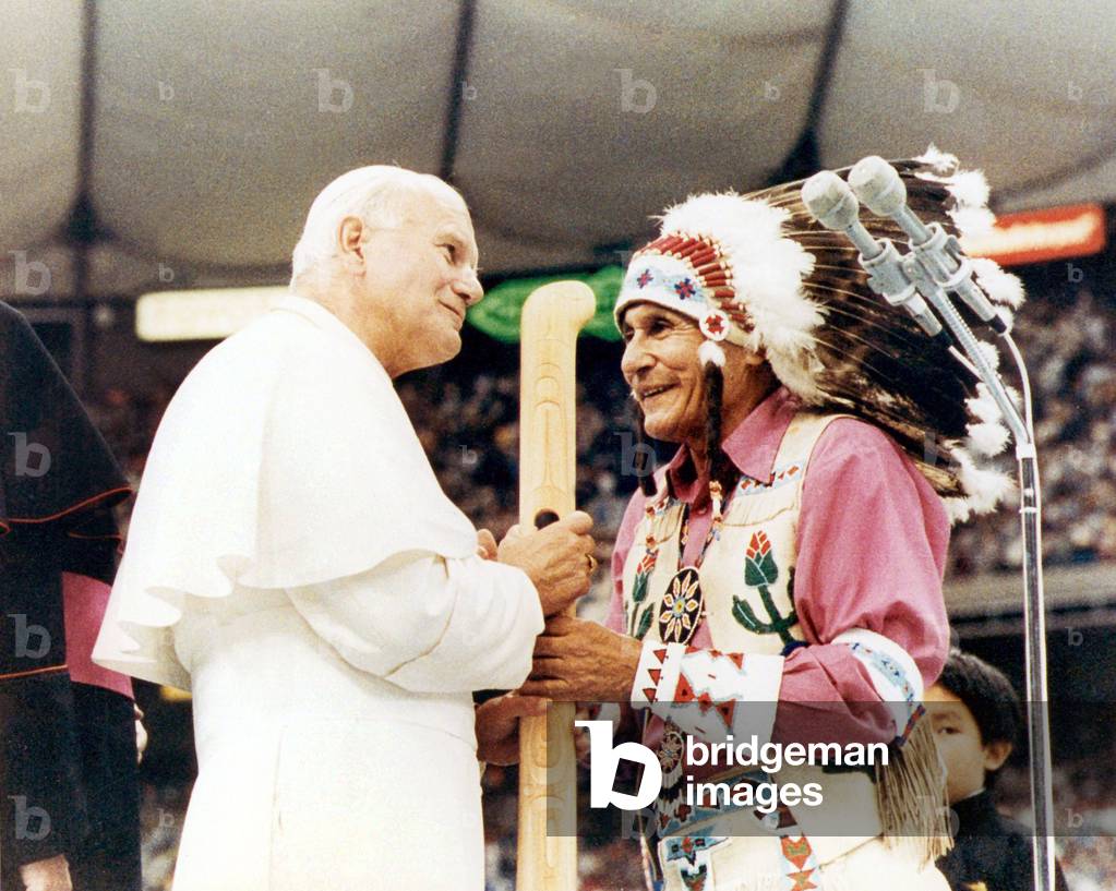 Pope John Paul II meets a native American during his pastoral visit to Canada, 1984 (photo)