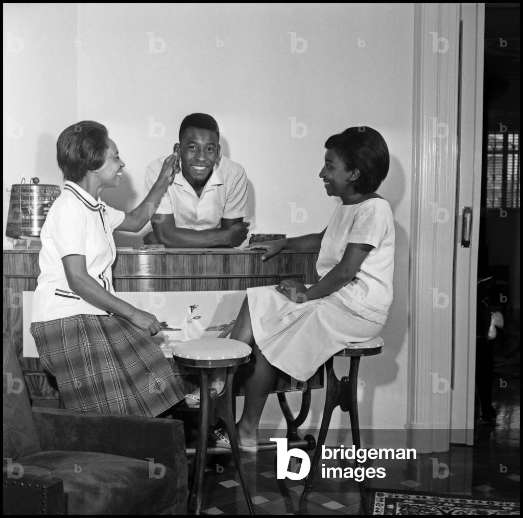 Pelé at home with his mother and his sister, Santos, Brazil, 1964 (b/w photo)
