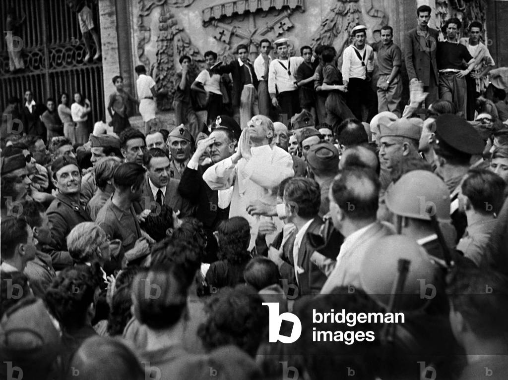 Pope Pius XII during a visit to one of the areas of Rome worst hit by the bombing, 1943 (b/w photo)