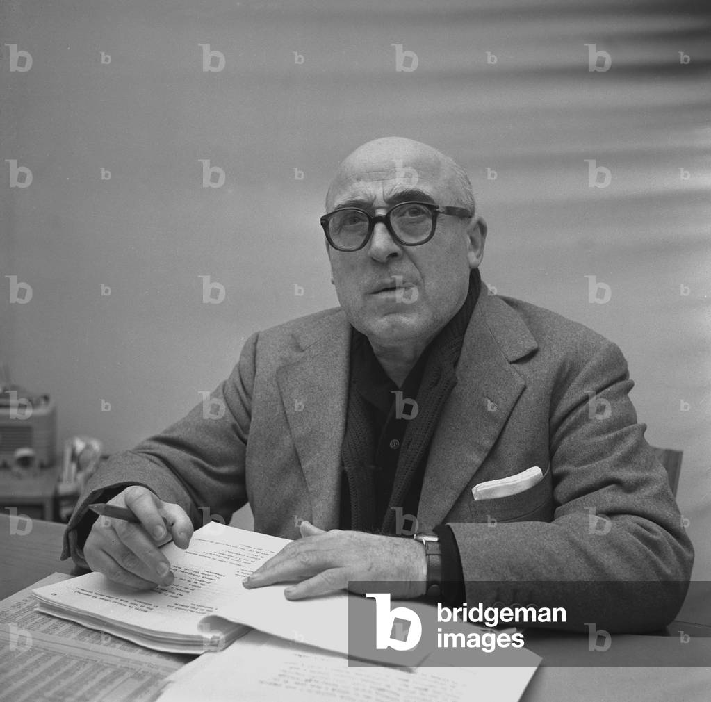 The screenwriter Cesare Zavattini at work in his house, May 1959 (b/w photo)