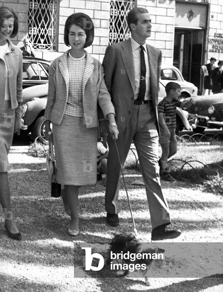 Prince Juan Carlos of Spain, walking in Piazza di Spagna square with his wife Sofia and their dog, Rome, Italy, 1964 (b/w photo)