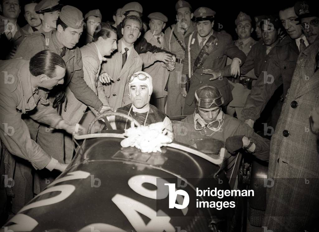 Tazio Nuvolari at the Mille Miglia car race, Brescia, Italy, 1948 (b/w photo)