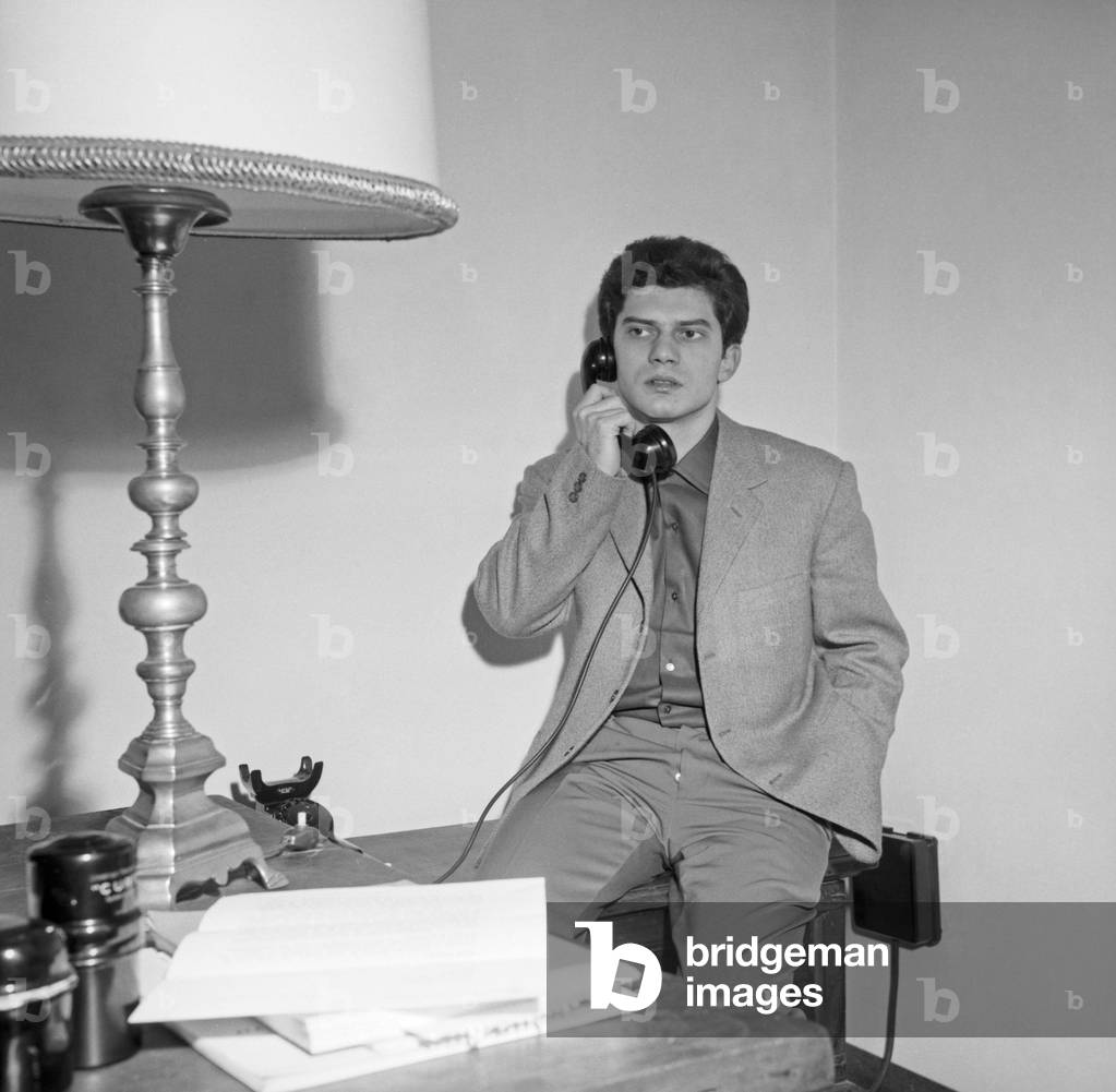 Luigi Tenco at his home, 1962 (b/w photo)