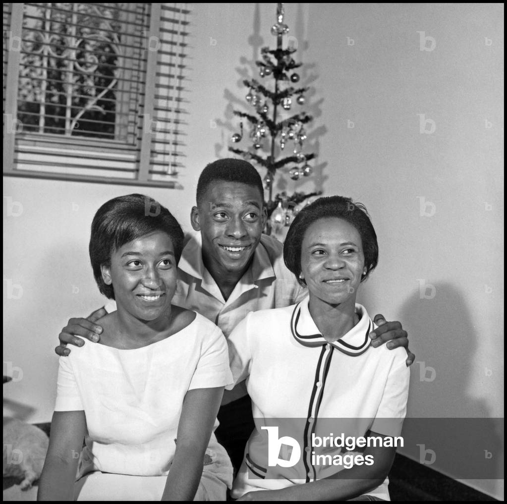 Pelé at home with his mother and his sister, Santos, Brazil, 1964 (b/w photo)
