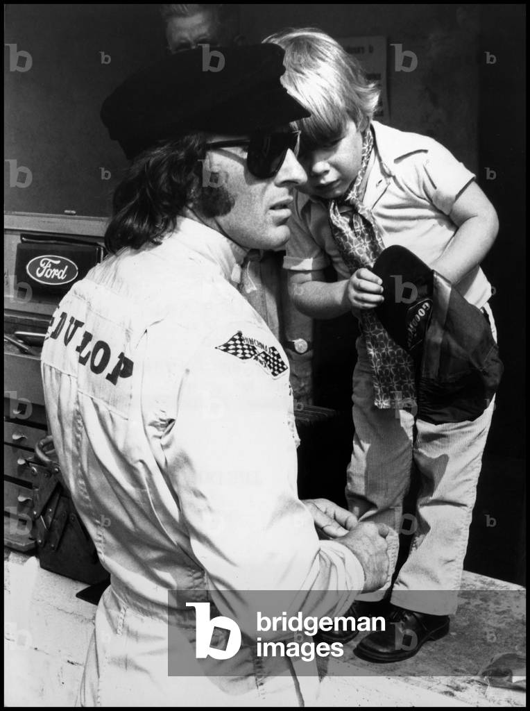 Jackie Stewart at the Italian Grand Prix with his son, Monza, 1969 (b/w photo)