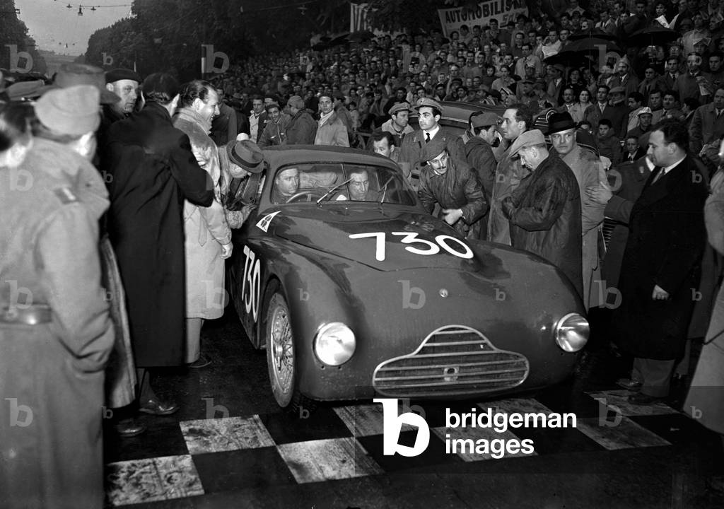 Juan Manuel Fangio's departure on an Alfa Romeo 6C 2500, Brescia, Italy, 1950 (b/w photo)