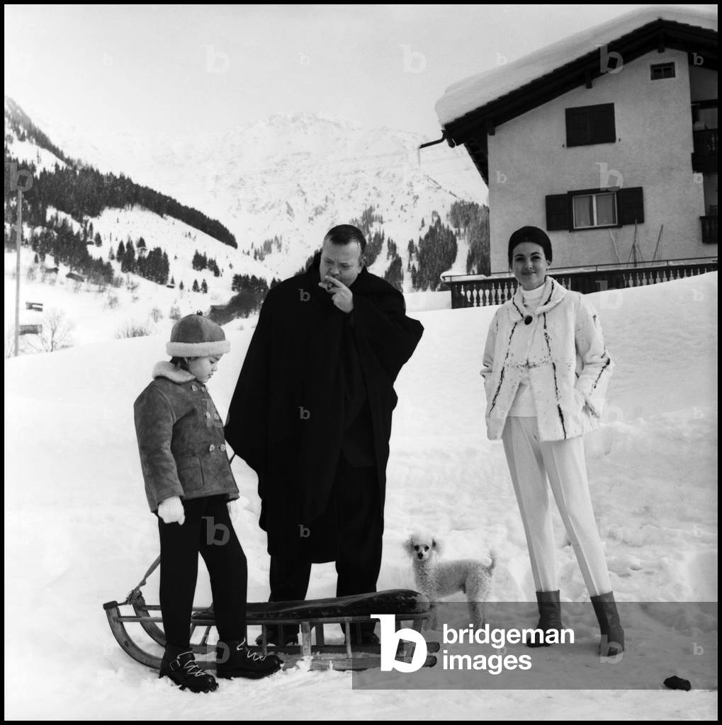 Orson Welles with his wife Paola Mori and their daughter Beatrice, Klosters, Switzerland, 1962 (b/w photo)