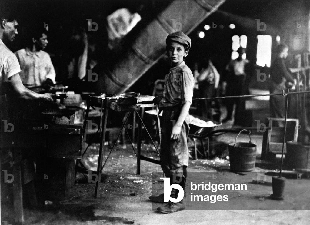 A child worker in a glass factory, New Jersey, 1909 (b/w photo)