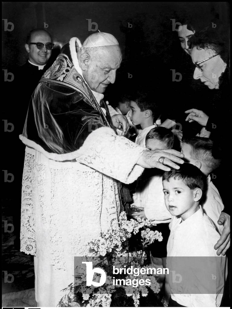 Pope John XXIII meeting children on Christmas eve, Vatican City, 1961 (b/w photo)
