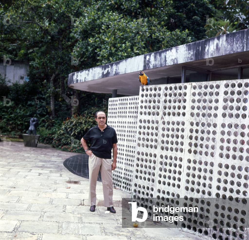 Oscar Niemeyer in  his garden, in Canoas (Brazil) Jan 1965 (b/w photo)