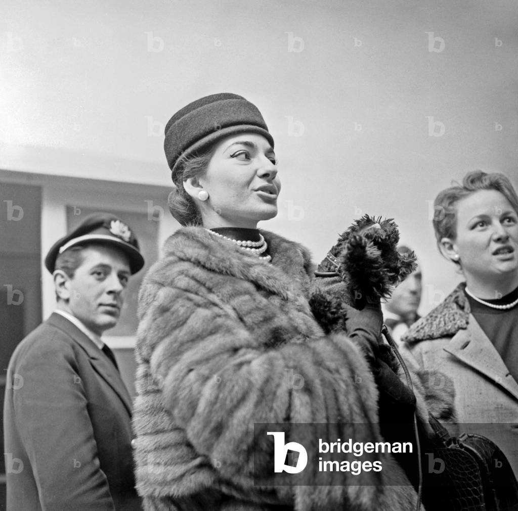 Maria Callas with her poodle in her arms, Milano-Malpensa Airport, 1956 (b/w photo)