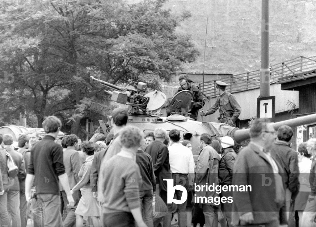 Demonstration in front of the radio headquarters, on Vinohradska street controlled by tanks, Prague, 1968 (b/w photo)