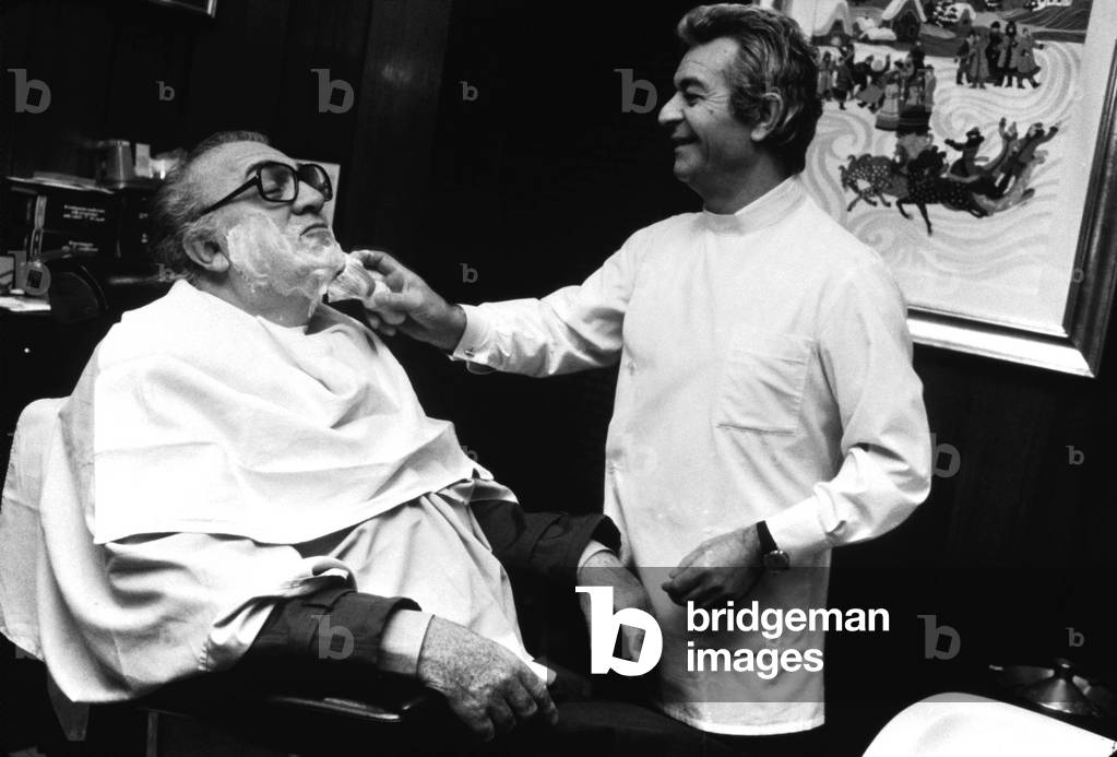 Federico Fellini at his regular barbershop, Rome, 1983 (b/w photo)
