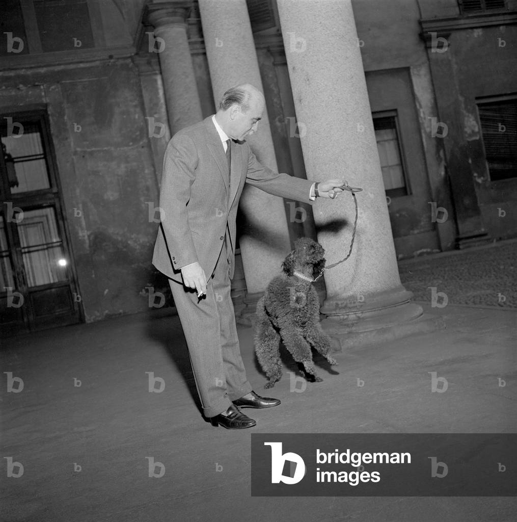 Lucio Fontana at the Sartotecnica, Milan, 1959 (b/w photo)