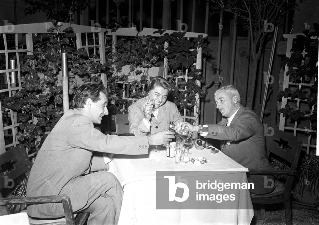 William Faulkner, Fernanda Pivano and a Mondadori executive, Milan, 1955 (b/w photo)