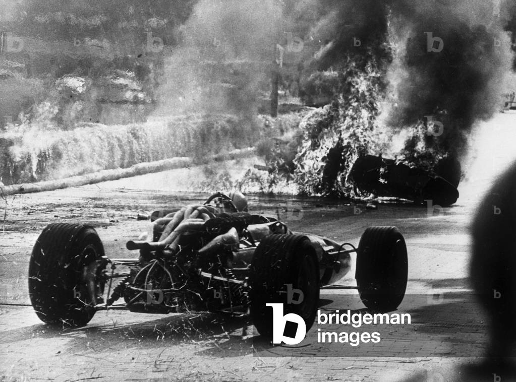 The Ferrari of Italian driver Lorenzo Bandini after his fatal accident at the Formula 1 Grand Prix, Montecarlo, Monaco, 1967 (b/w photo)