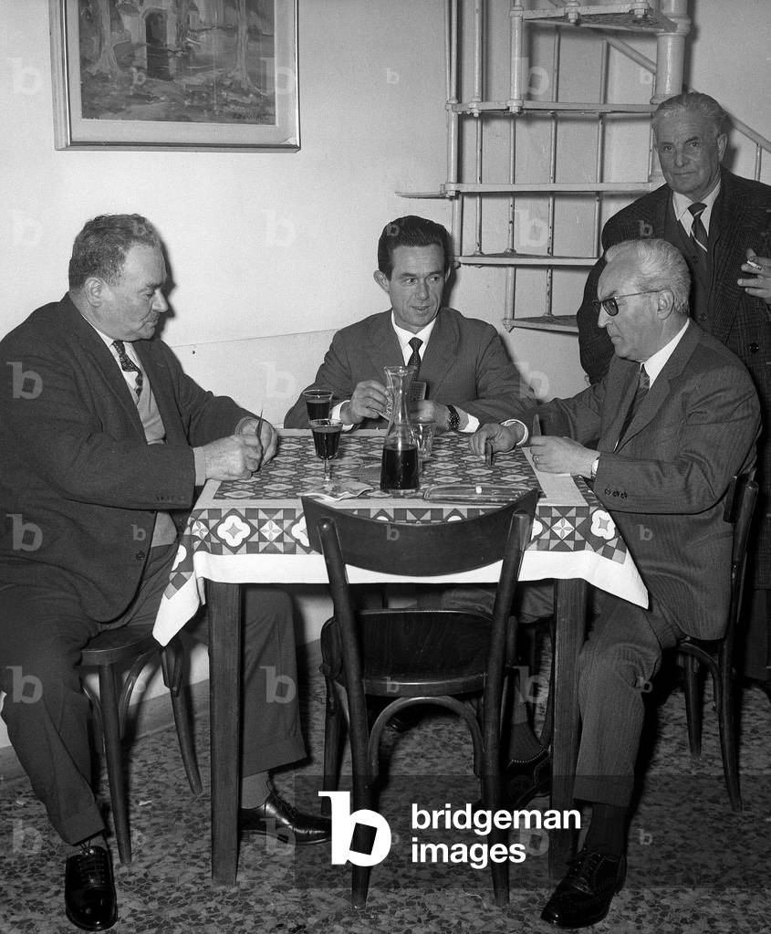 Piero Chiara with friends in a inn near Luino, Italy (b/w photo)