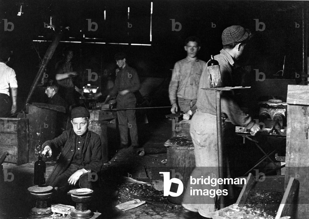 A child worker in a glass factory, New Jersey, 1909 (b/w photo)
