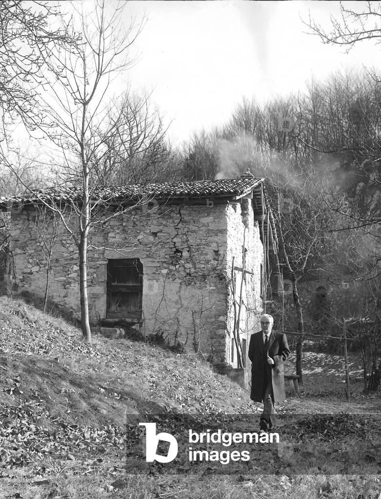 Piero Chiara walking on his property, Varese, Italy, 1986 (b/w photo)