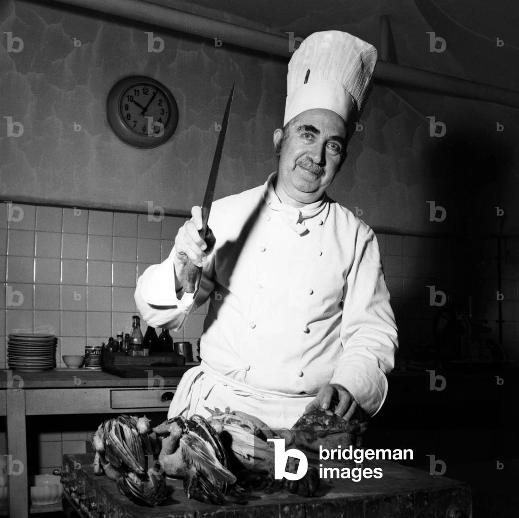 Chef Ottolini in the kitchen of the Hotel Milano restaurant, Milan, Italy, 1951 (b/w photo)