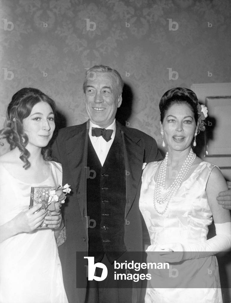 Anjelica Houston, her father and Ava Gardner, Milan, 1966 (b/w photo)