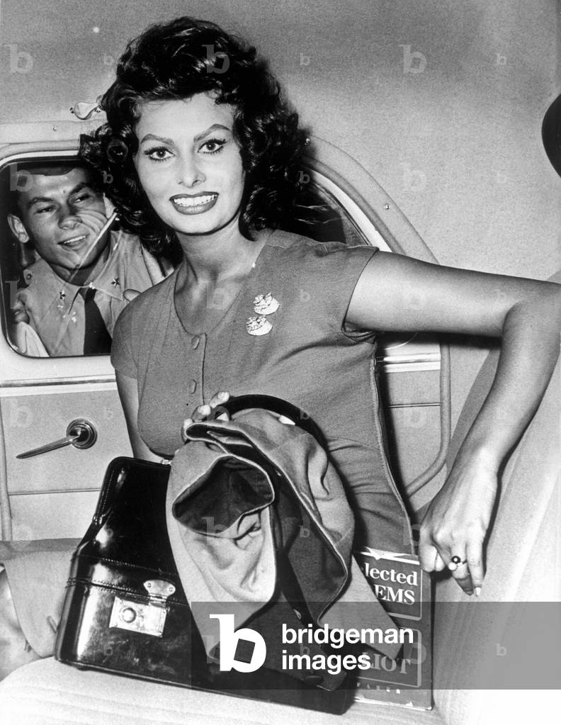 Sophia Loren in a car stormed by fans, Rome, 1956 (b/w photo)