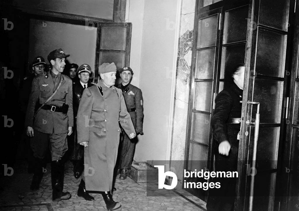 Visit of Benito Mussolini and fascist secretary Alessandro Pavolini to the Legion Muti headquarters, Milan, 1944 (b/w photo)