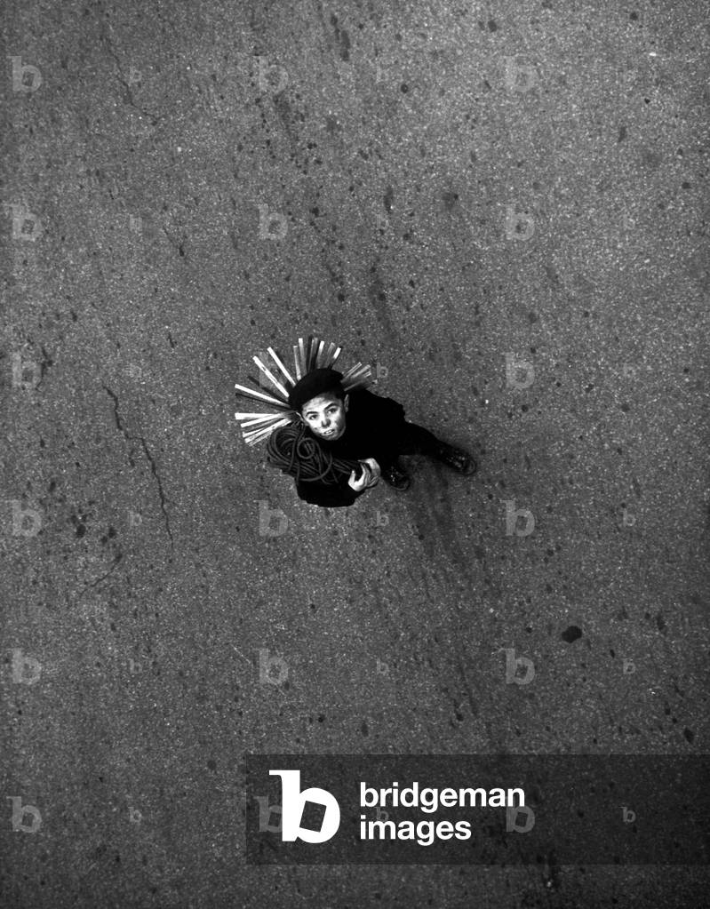 A little chimney sweep in the streets, Milan, 1961 (b/w photo)